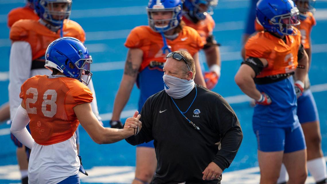 Boise State Special Teams Coordinator Stacy Collins gets the Broncos moving through warmups during practice at Albertsons Stadium in August.