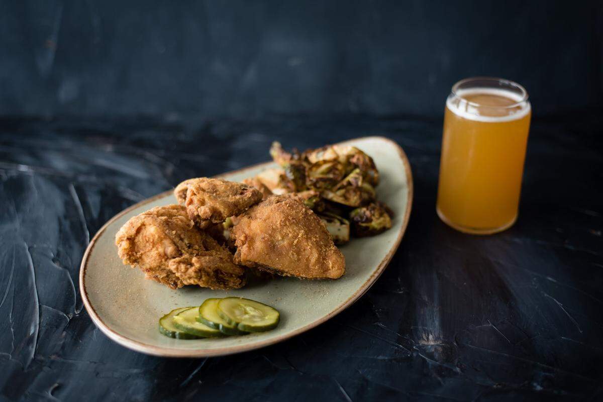Tupelo Honey’s Honey Dusted Fried Chicken is brined before it’s cooked. And, yes, it will taste good paired with a pint of IPA.