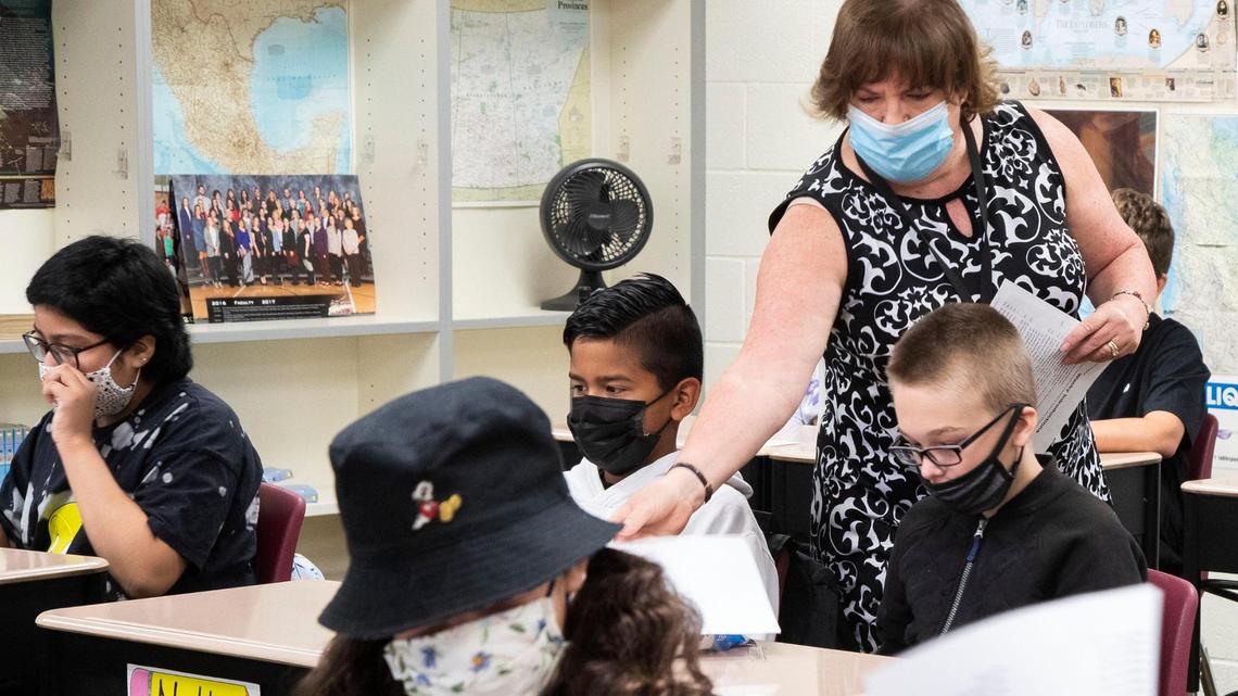 Morley Nelson Elementary sixth grade teacher Christine Boyer reacquaints students to the classroom with handouts on Aug. 16, 2021. Students and staff no longer need to wear masks in the classroom starting Tuesday.