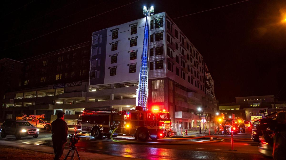 Boise firefighters respond to a 8-story, unfinished apartment building after flames and smoke were reported coming from the roof Thursday night in Downtown Boise.