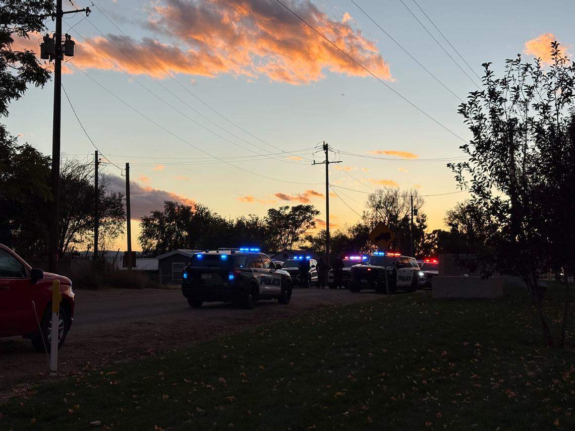 The lights on police cars still flash near La Catedral Arena after the FBI raided a property in Wilder, Idaho on Sunday.