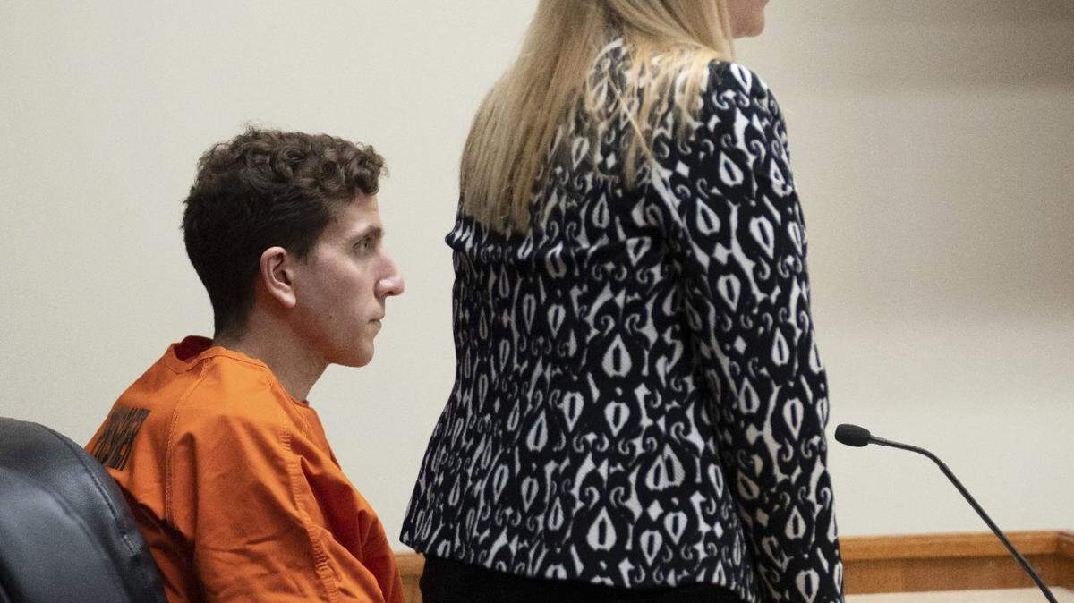 Bryan Kohberger, seated, who is accused of killing four University of Idaho students on Nov. 13, looks on as his attorney, public defender Anne Taylor, speaks during a hearing.