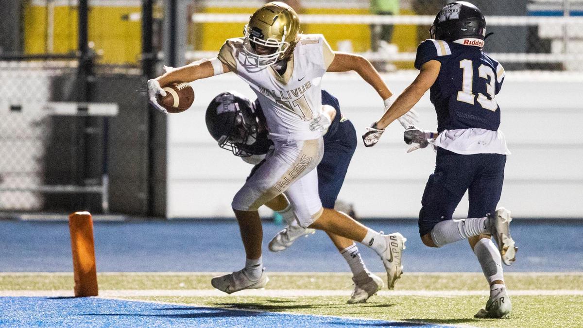 Vallivue wide receiver Camryn Deane reaches the ball over the goal line against Middleton earlier this season.