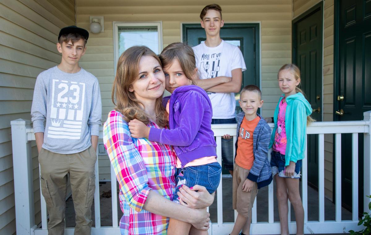 Halyna Isaieva, a refugee from Ukraine, is the sole supporter for her family Ñ from left, Artur, 15, Anna, 4, Vlad, 16, Maksym, 6, and Diana, 9. Isaieva went through a program at IRC that helps refugees get training for higher paying jobs, and now she works as an EVS techs (Environmental Services Technicians) in the St. Luke’s health system, cleaning and disinfecting hospitals.