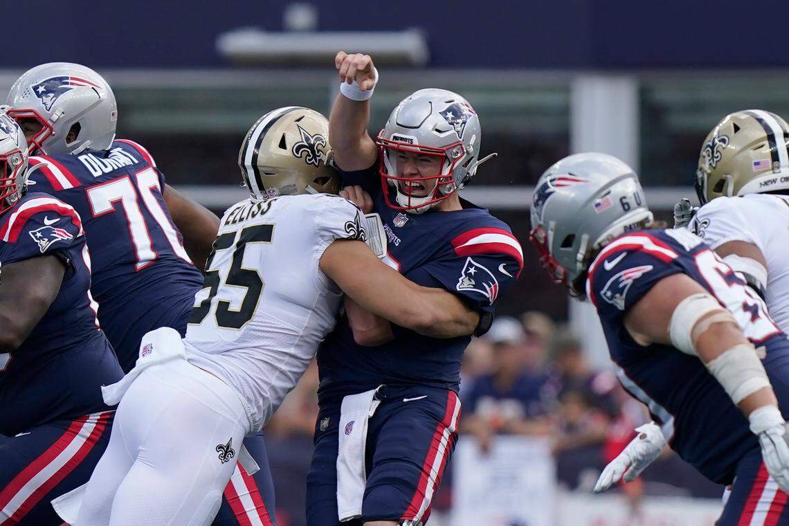 New Orleans Saints linebacker Kaden Elliss puts pressure on New England Patriots quarterback Mac Jones during the first half of an NFL football game Sunday in Foxborough, Mass.