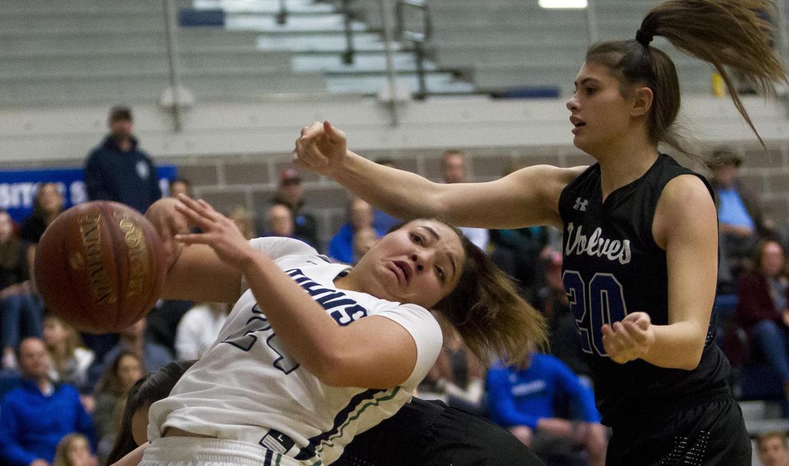 Mountain View won back-to-back state titles in 2015 and ’16. It enters this year’s girls basketball state tournament undefeated and favored to hang another banner. Above, sophomore Trinity Slocum, left, gets hit from below while fighting for a rebound with Timberline’s Madison Thomas earlier this season.