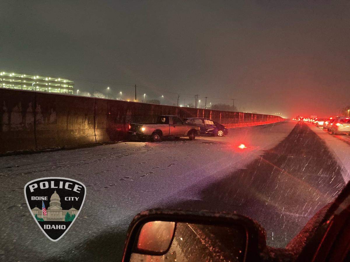 A crash on Interstate 84 in Boise on Friday night. Boise police closed the freeway between Orchard Street and Gowen Road, a distance of more than four miles, as snow made roads increasingly hazardous.
