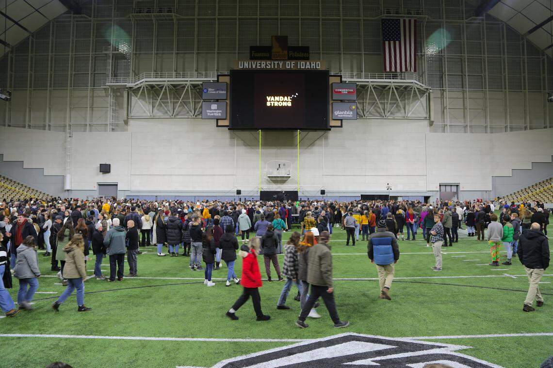 A crowd gathers for a candlelight vigil in the University of Idaho’s Kibbie Dome in Moscow to honor the lives of four students killed at an off-campus home Nov. 13.