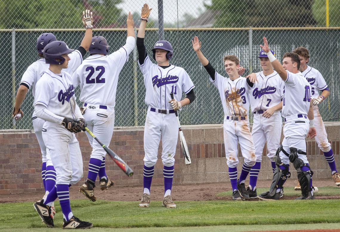 A sacrifice fly by Danny Burns scores Conor Christiansen (22) and Gabe Hughes to take a 6-0 lead in the bottom of the third inning. Rocky Mountain beat Boise 10-0 in five innings in the first round of the 5A state baseball tournament at Capital High on Thursday, May 16, 2019.