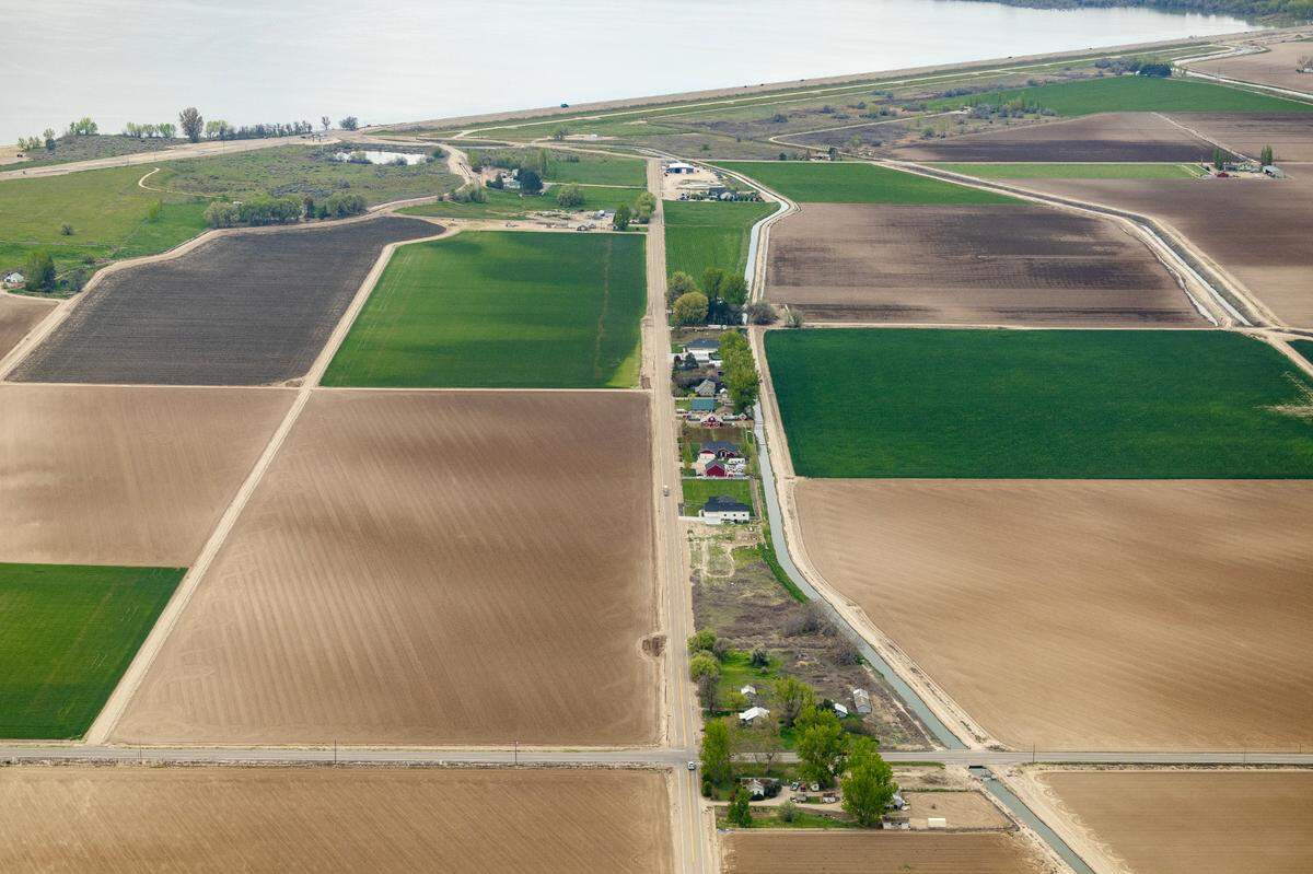Farm land north of Lake Lowell in Canyon County, with the reservoir and its lower dam at top.