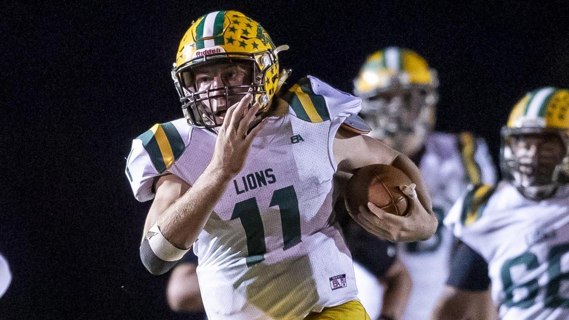 Borah quarterback Austin Bolt breaks through Capital’s defense for a 56-yard touchdown run in Thursday’s 42-35 win over Capital. Bolt racked up 289 rushing yards and six touchdowns in the rivalry win.