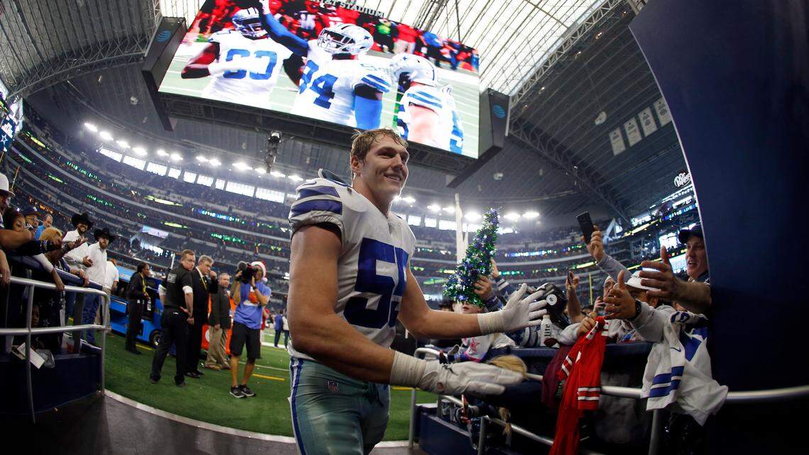 Dallas Cowboys linebacker Leighton Vander Esch celebrates with fans as he leaves the field after a game against the Tampa Bay Buccaneers on Dec. 23, 2018, in Arlington, Texas.
