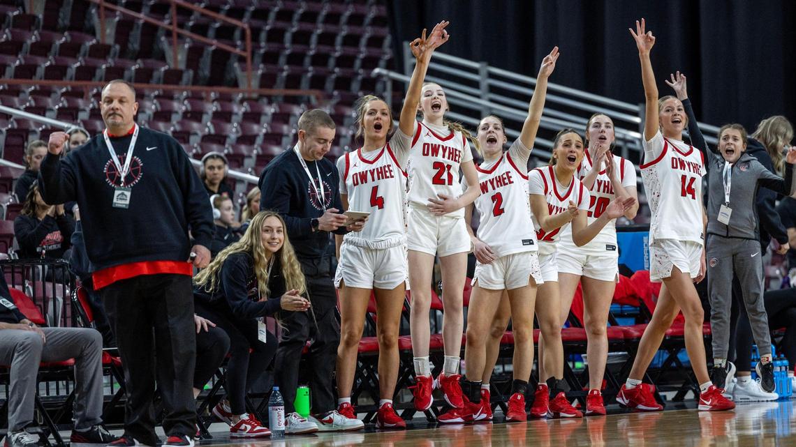 Owyhee’s bench celebrates after 3-pointer against Capital in the first round of the 6A girls basketball state tournament Thursday.