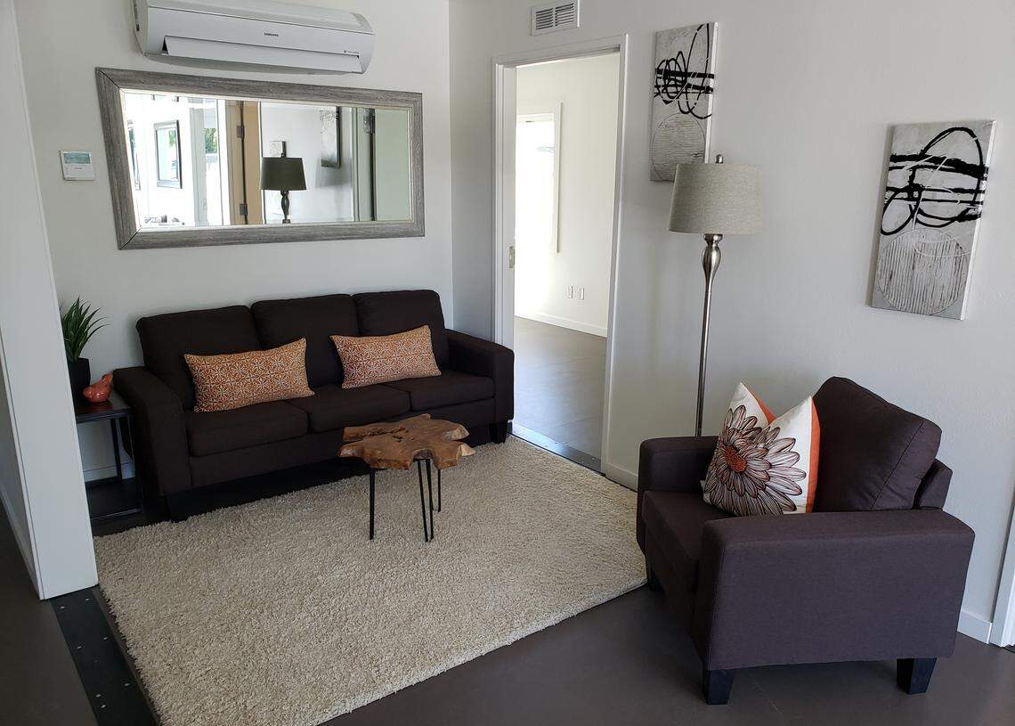 Two of the four bedrooms lead off the living room at the front of the house.