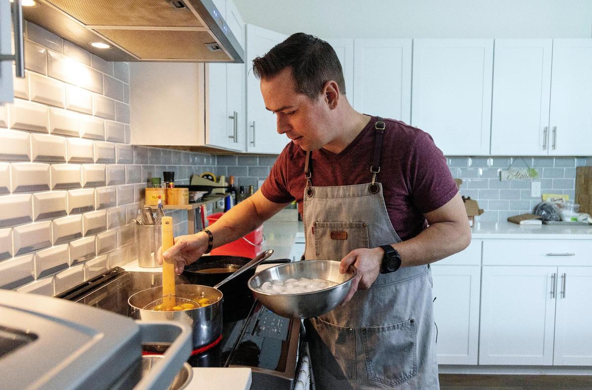 Boise chef Jonathon Merrick prepares food at his home kitchen on Tuesday, Aug. 16, 2022. Merrick is known for hosting pop-up dinners and sharing his love of food through his Tik Tok channel.