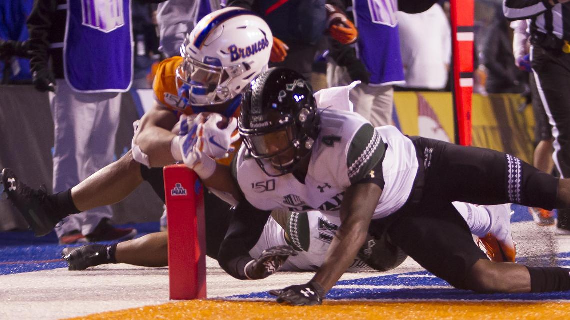Boise State running back George Holani (24) hits the end zone pylon on a rushing touchdown while he’s defended by Hawaii defensive back Rojesterman Farris II (4) in the third quarter Saturday, Oct. 12, 2019 at Albertsons Stadium in Boise.