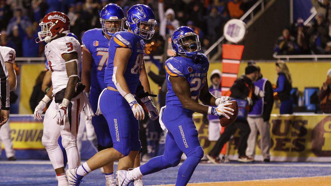 Boise State running back Alexander Mattison (22) celebrates after his first touchdown of the night against Fresno State on Friday, Nov. 9, 2018, at Albertsons Stadium.