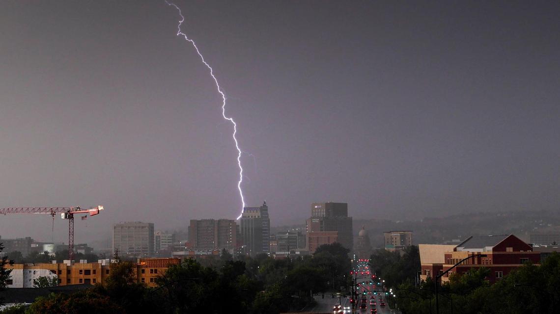 A bolt of lightning strikes over the downtown Boise skyline as a severe thunderstorm rolled through the Treasure Valley.