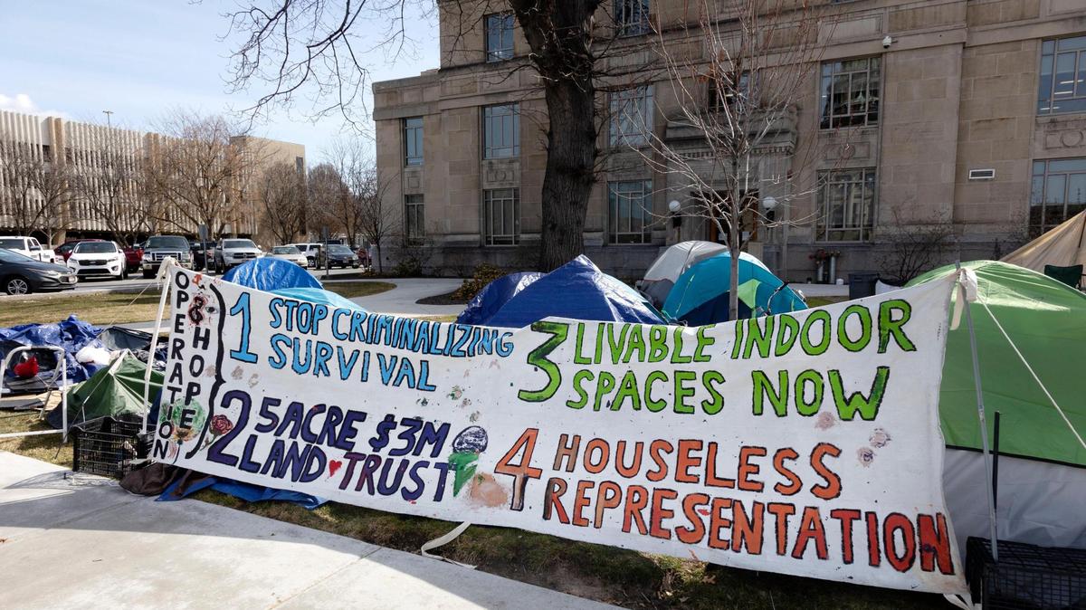 Shortly before crews took down several tents and cleared trash on March 18, a large sign spanned several tents outlining the purpose of the homeless protest in downtown Boise known as Operation Hope.