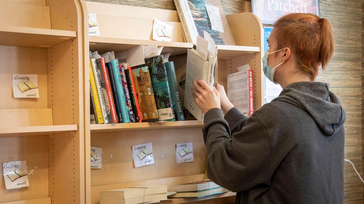 Kvothe Harris organizes books for curbside pickup at Rediscovered Books. Gov. Brad Little’s amended orders for essential and nonessential businesses means expanded services for the bookstore. Thursday was Harris’ first day on the job after a two-week furlough.