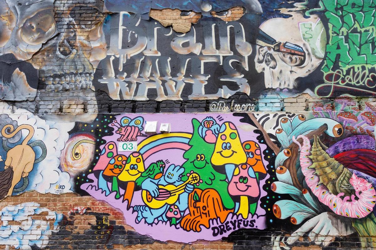 Graffiti-style art lines the walls of Freak Alley Gallery.