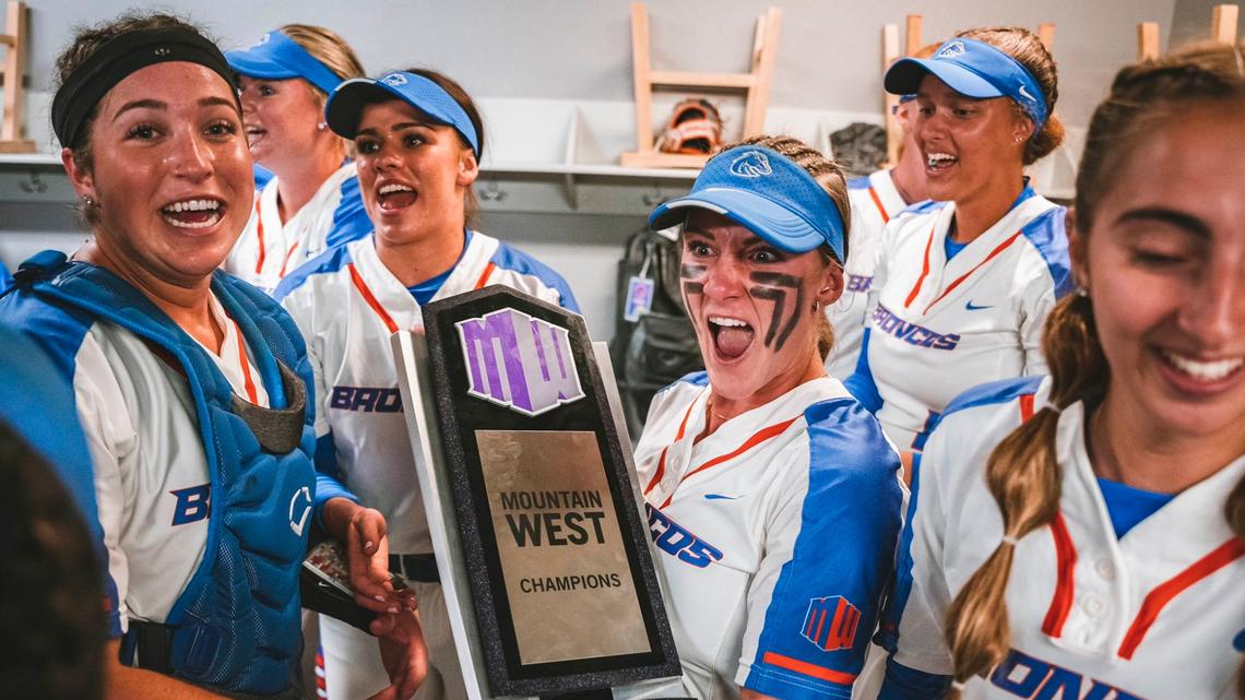 The Boise State softball team celebrates with the Mountain West regular season championship trophy after a 3-0 win at Fresno State on Friday.