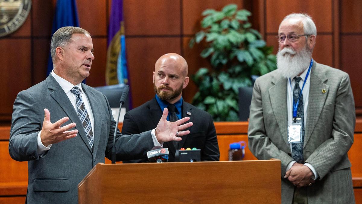 Idaho State Police Lt. Darren Gilbertson, left, with Brett Payne, center, formerly a corporal with Moscow police, speak to members of the media about the investigation after Bryan Kohberger’s sentencing hearing in July 2025. Latah County Prosecutor Bill Thompson stands to the right.