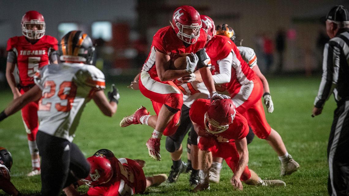 Homedale running back Hayden Kincheloe hurdles over defenders against Fruitland on Oct. 23.