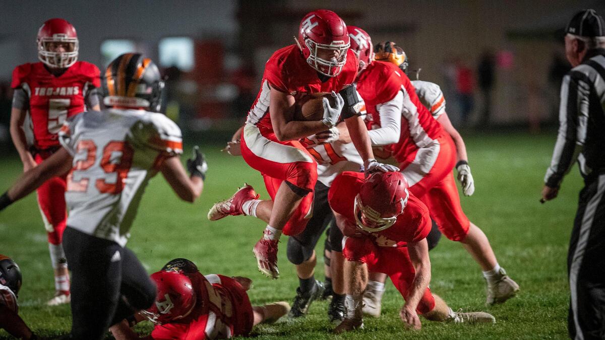 Homedale running back Hayden Kincheloe hurdles over defenders against Fruitland on Oct. 23.