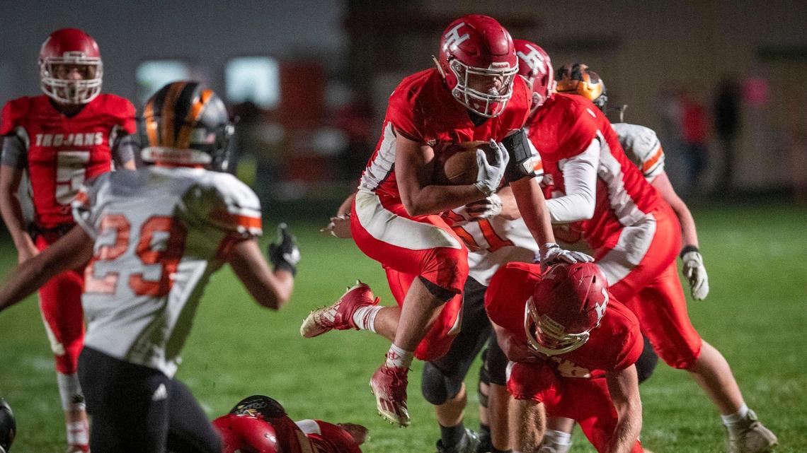 Hayden Kincheloe flies through Fruitland defenders for positive yards. Kincheloe scored two of Homedale’s four touchdowns Friday as the Trojans beat Fruitland 28-14 to win their third straight 3A SRV title on Friday, Oct. 23, 2020 at Homedale.
