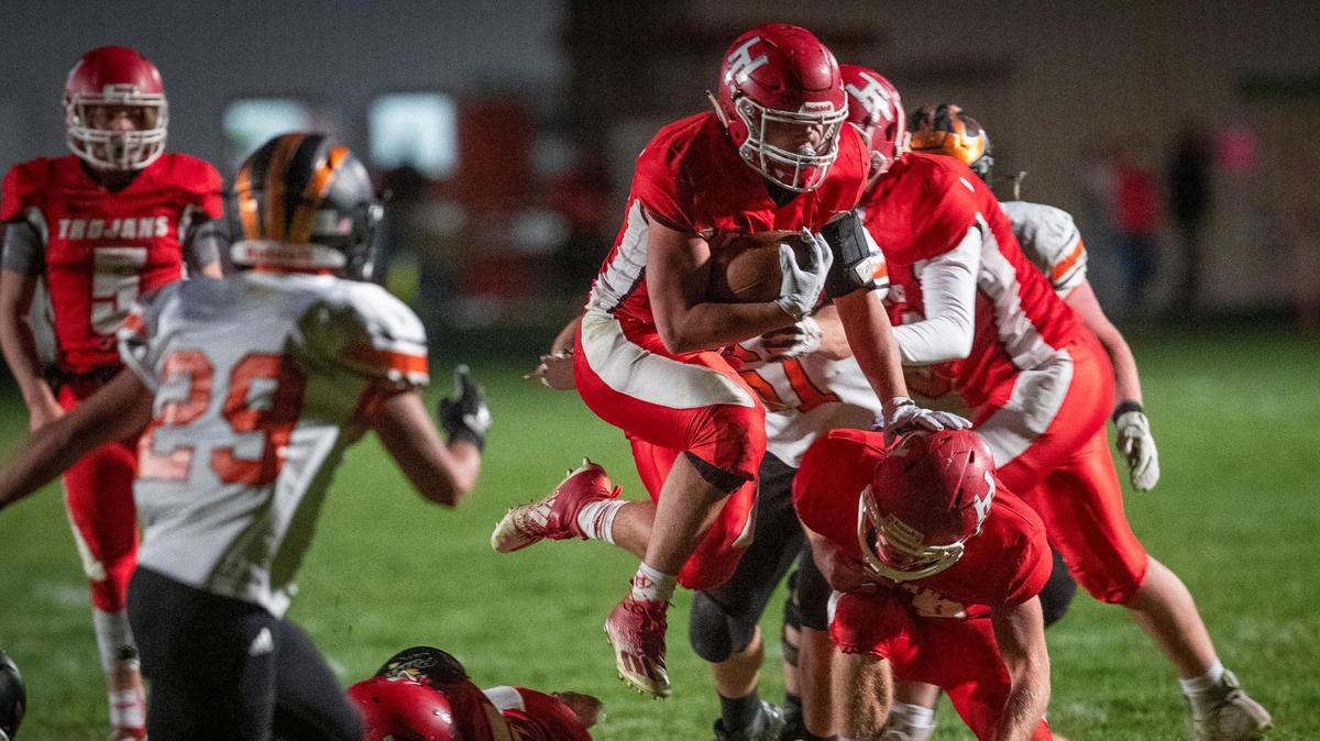 Hayden Kincheloe flies through Fruitland defenders for positive yards. Kincheloe scored two of Homedale’s four touchdowns Friday as the Trojans beat Fruitland 28-14 to win their third straight 3A SRV title on Friday, Oct. 23, 2020 at Homedale.