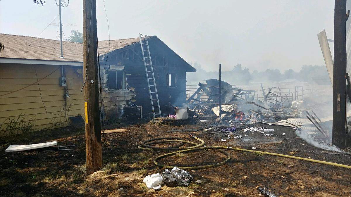 A fast-moving fire burned a Meridian house, garage and barn on Monday. No one was injured in the fire, and two cats were rescued.