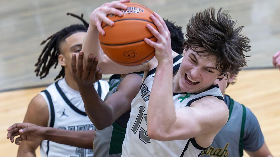 Capital guard David McNamara comes down with a defensive rebound against Borah on Jan. 31.