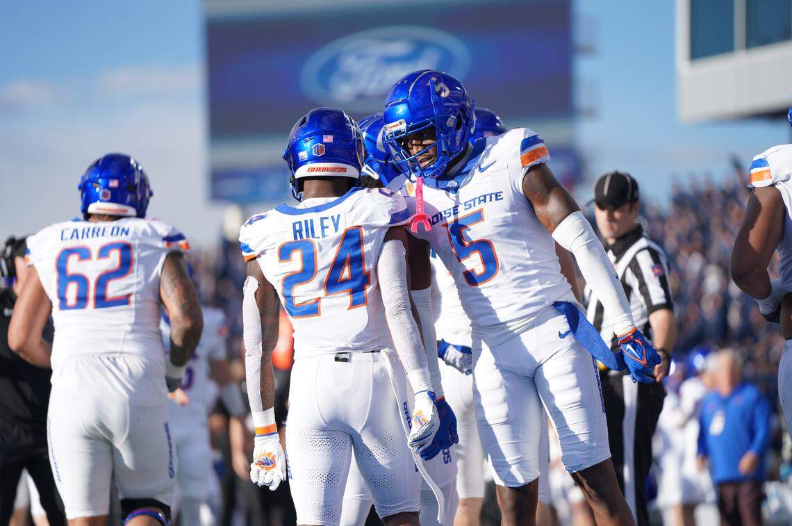 Boise State wide receiver Chris Marshall celebrates with Dylan Riley (24) in the first half against Air Force on Saturday.