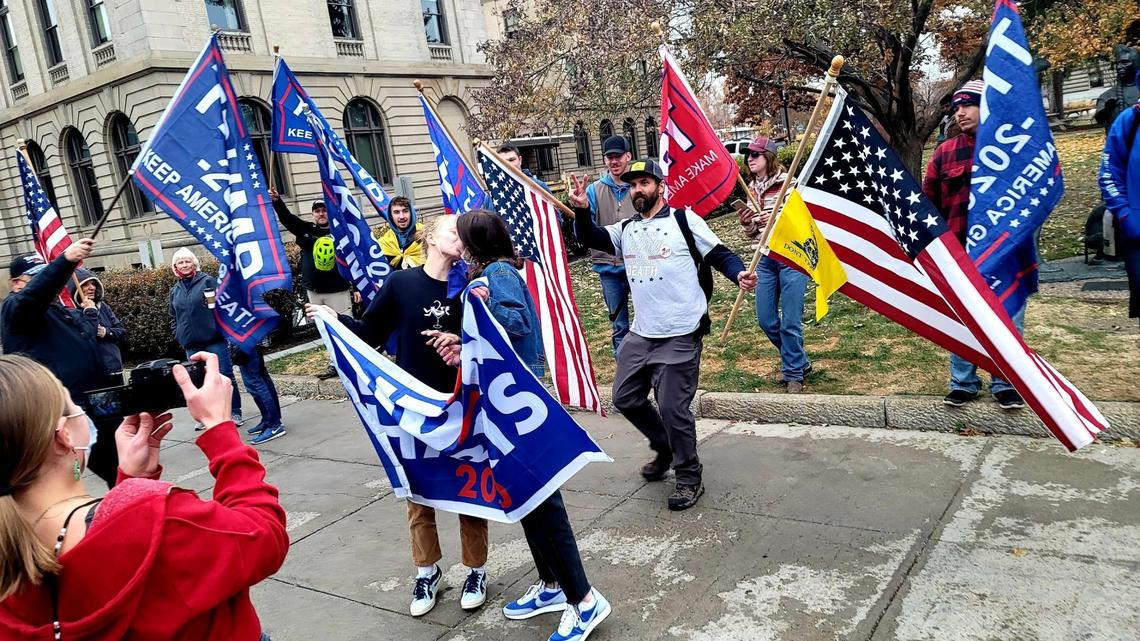 Two women kiss in front of Donald Trump’s supporters near the Idaho State Capitol during a peaceful end of election celebration on Saturday, Nov. 7, 2020 in Downtown Boise.