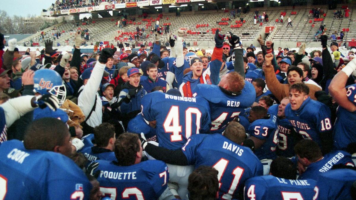 Boise State football players and fans celebrate the Broncos’ 28-24 comeback win over Marshall in the 1994 I-AA national semifinals at then Bronco Stadium in Boise. “Those guys were really close, and they’re still really close,” said Tom Mason, the Broncos’ defensive coordinator at the time.