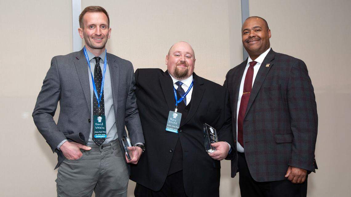Idaho State Police Cpl. David Wesche, left, and Communications Center Supervisor Raymond Shute, center, received Heroes Awards from the National Center for Missing & Exploited Children on May 11 for their rescue of an 11-year-old Georgia boy a year prior. The event was hosted at the Spy Museum in Washington, D.C.