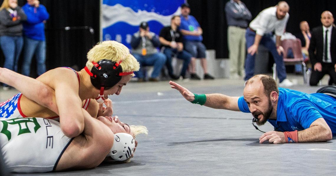 Nampa wrestler Nikko Gonzalez smiles in the final seconds of his 5A 138-pound state championship match against Tanner Frothinger of Eagle.