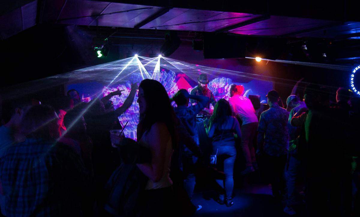 A DJ spins tunes at Karma dance club in downtown Boise.