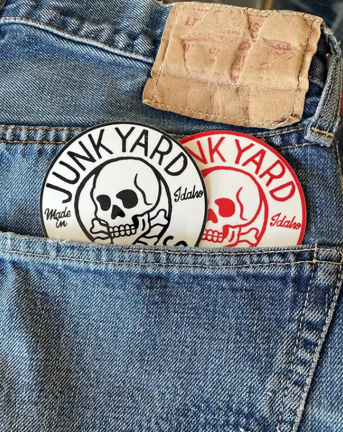 Stickers featuring the Junkyard Jeans logo sit in the pocket of a pair of vintage Levi’s jeans in this photo shared to the denim boutique’s Instagram, @junkyardjeans_official.