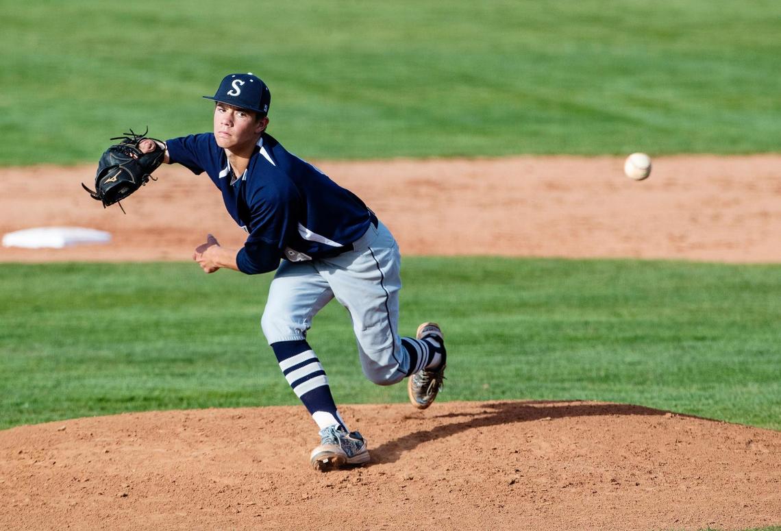 Skyview’s Grayden Lucas falls off toward third base, beginning the process of moving his glove to his left hand Thursday at Timberline.