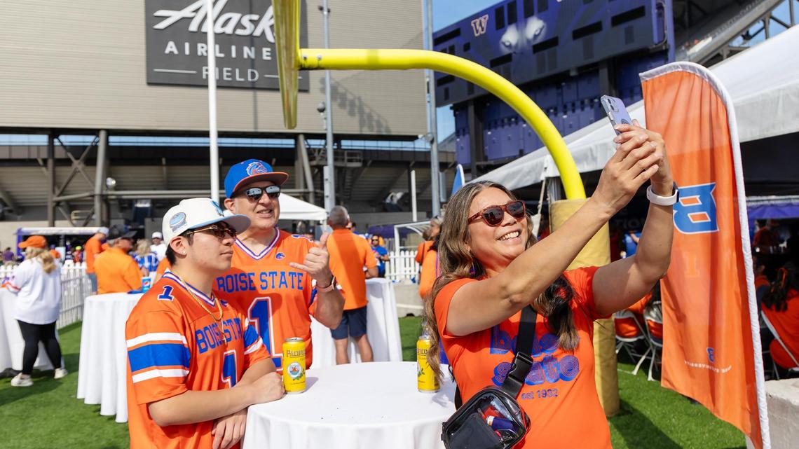 Linda Sparks takes a selfie with her son, BSU student Rueben Sparks, and husband Marty Sparks at the Boise State University Alumni Association tailgate.