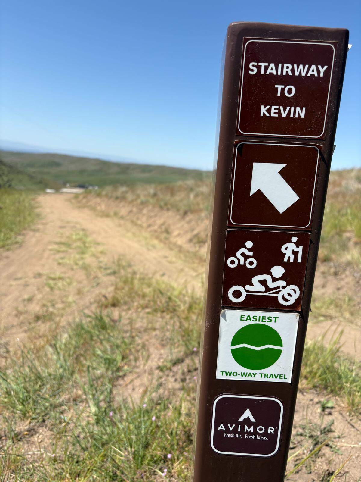 The trail climbing up into the heights of Kevin Pavlis Park, named for the man himself.