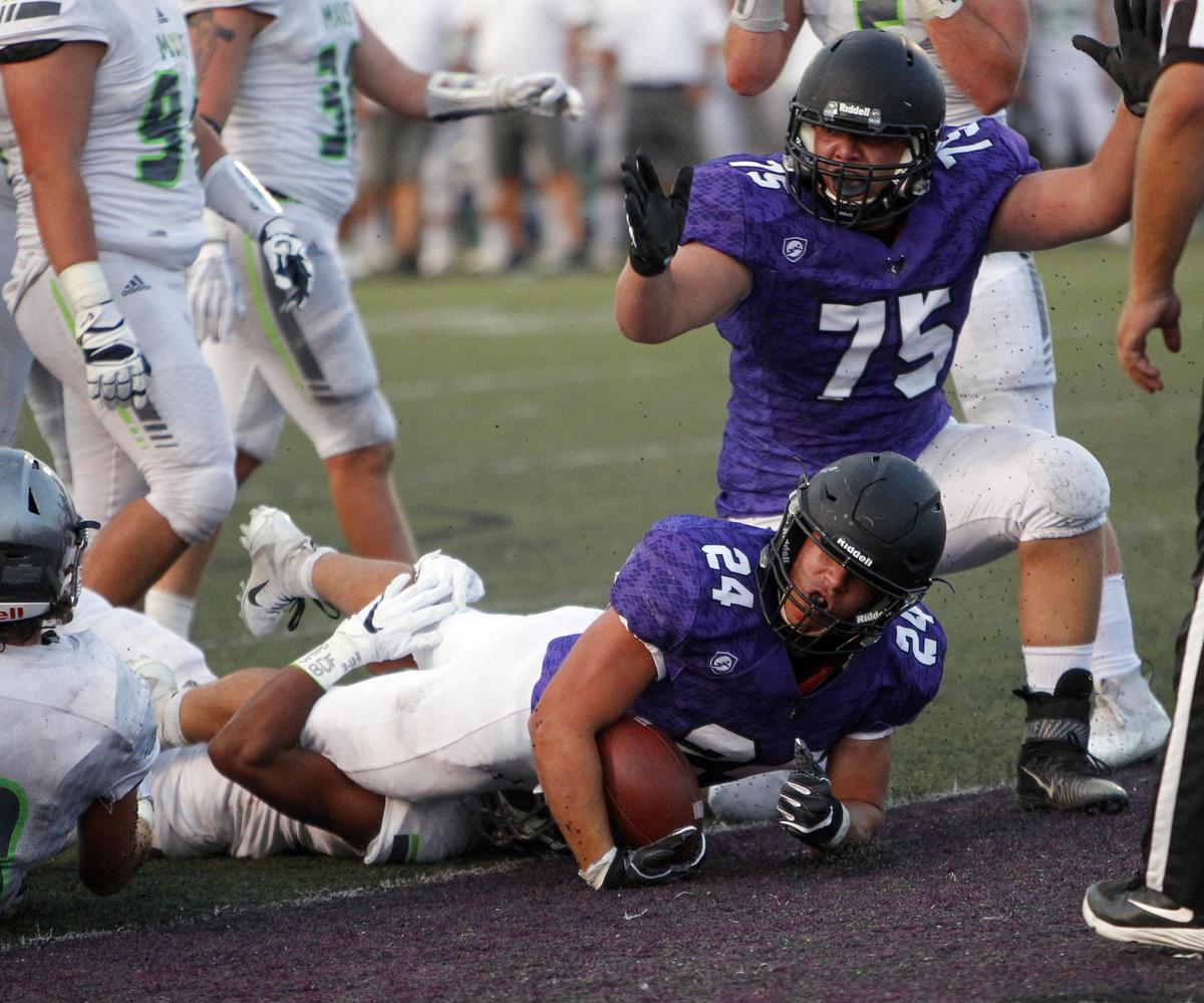 Rocky Mountain running back Nick Romano checks for the touchdown signal earlier this season against Mountain View.