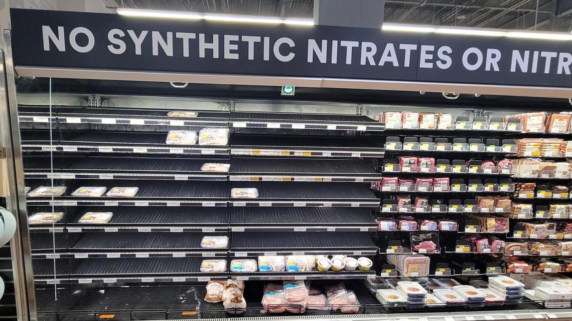 The meat case at Whole Foods in Boise was nearly empty Tuesday. Winter storms and increases in COVID-19 cases across the nation have led to some grocery industry shortages.
