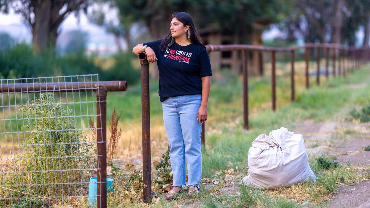 Alejandra Hernandez prepares to deliver a bag of donated clothes to agricultural workers in Hammett. The clothes were intended to help the farmworkers deal with the record-breaking high temperatures in Idaho this summer. Hernandez is one of the founders of Latinx Farmworkers of Southern Idaho, part of the Idaho Immigrant Resource Alliance, which raises money to buy cooling and hydrating items for farmworkers.