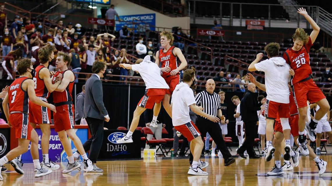 Boise celebrates an upset win over Rigby in the first round of the 5A boys basketball state tournament Thursday at the Ford Idaho Center in Nampa.