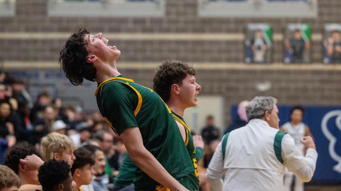 Borah senior Miles Welch reacts to the Lions’ 72-67 upset win over Capital in overtime in the first round of the 6A District Three boys basketball tournament on Tuesday at Mountain View High.