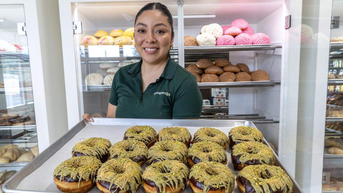 Janet Gurrola, manager at La Esperanza, holds a tray of Dubai chocolate donuts at the popular bakery in Nampa.