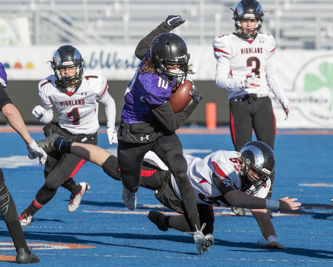 Rocky Mountain defensive back Kaimana Nawahine runs back an interception during the 5A state football championship Saturday, Nov. 17, 2018 at Albertsons Stadium in Boise.